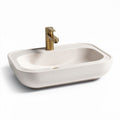 Lavabo en résine beige avec robinet doré dimensions 50 x 35 x 15cm